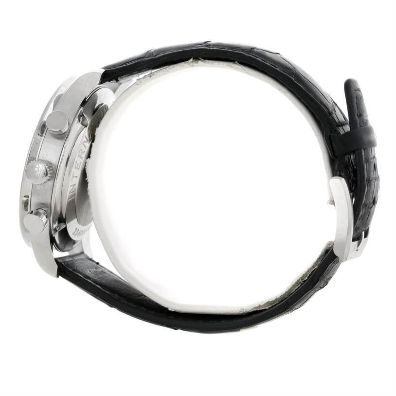 The image shows a side view of an IWC Portuguese IW371445 Men's Stainless Steel Silver Dial IW371445 Men's Stainless Steel Silver Dial model watch, displaying its crown, pushers, and black leather strap.