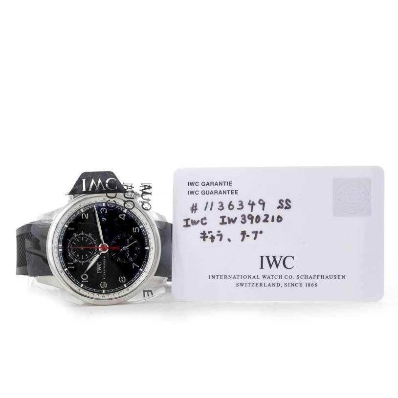 The IWC Portuguese IW390210 Men's Stainless Steel Black Dial IW390210 Men's Stainless Steel Black Dial model IW390210 is shown from a front angle along with its guarantee card.