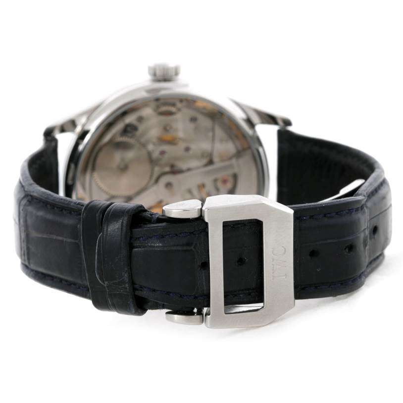 The IWC Portuguese IW500107 Men's Stainless Steel Silver Dial IW500107 Men's Stainless Steel Silver Dial model watch is shown from the rear, highlighting its back case and leather strap with an IWC clasp.