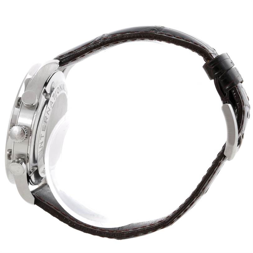 The image shows a side view of the IWC Portuguese IW371438 Men's Stainless Steel Black Dial IW371438 Men's Stainless Steel Black Dial watch, detailing its case, crown, pushers, and part of the leather strap.