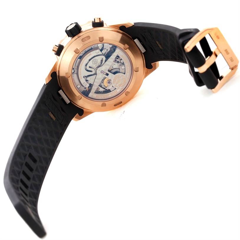 The image shows the back and side view of an IWC Aquatimer IW376903 Men's Rose Gold Black Dial IW376903 Men's Rose Gold Black Dial watch, highlighting the movement and rubber strap.