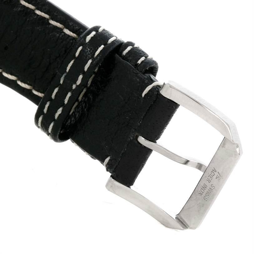 The image shows a close-up of the buckle and part of the leather strap of an IWC Pilot IW325101 Men's Stainless Steel Black Dial IW325101 Men's Stainless Steel Black Dial model watch.