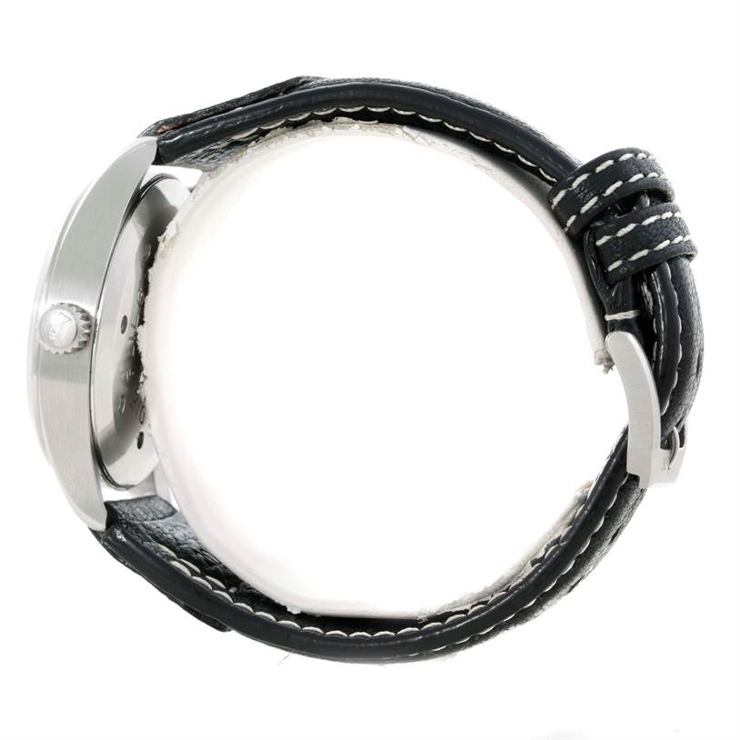 This image shows a side view of the IWC Pilot IW325101 Men's Stainless Steel Black Dial IW325101 Men's Stainless Steel Black Dial model watch, highlighting the crown, case side, and leather strap with stitching.