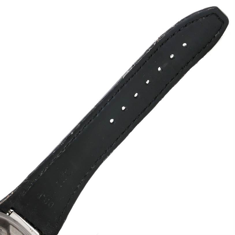 The image shows the leather strap of the IWC Ingenieur IW500501 Men
s Stainless Steel Black Dial IW500501 Men
s Stainless Steel Black Dial watch from a close-up angle, focusing on the buckle end with adjustment holes.