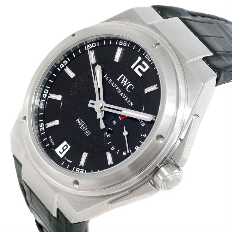 The image shows an IWC Ingenieur IW500501 Men
s Stainless Steel Black Dial IW500501 Men
s Stainless Steel Black Dial watch from an angled close-up, displaying the face, bezel, crown, and part of the leather strap.