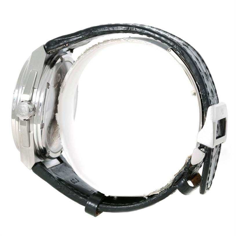 The image shows the side angle of an IWC Ingenieur IW500501 Men
s Stainless Steel Black Dial IW500501 Men
s Stainless Steel Black Dial watch, highlighting its crown, case, and partial view of its leather strap.