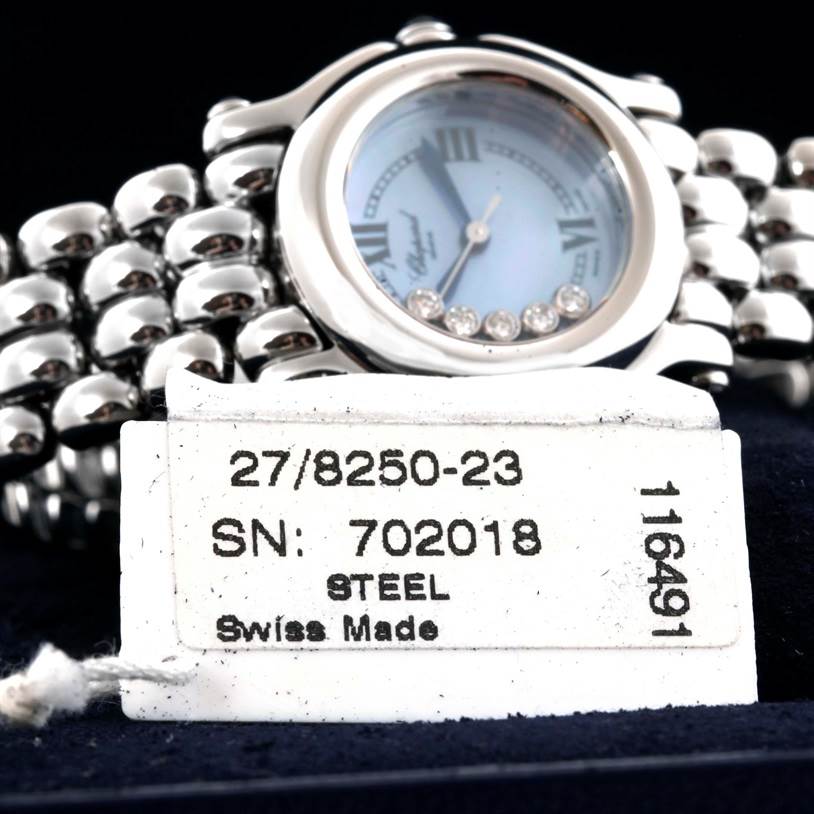 The image shows a close-up of the Chopard 27/8250-23 Women's Stainless Steel Mother of Pearl Dial 27/8250-23 Women's Stainless Steel Mother of Pearl Dial Happy Sport Bleu Dial 5 Floating Diamonds Watch model 27/8250-23 displaying its dial and steel bracelet.
