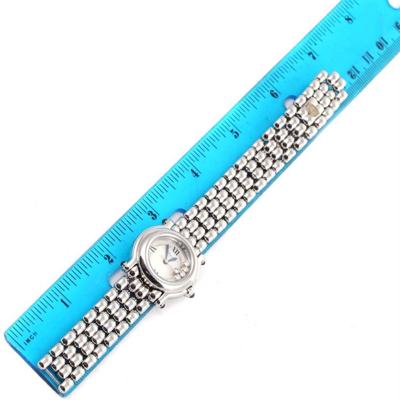 The Chopard 27/8250-23 Women's Stainless Steel White Dial 27/8250-23 Women's Stainless Steel White Dial Happy Sport White Dial 5 Floating Diamonds Watch 27/8250-23 is shown laid flat next to a blue ruler, displaying the face and full bracelet.