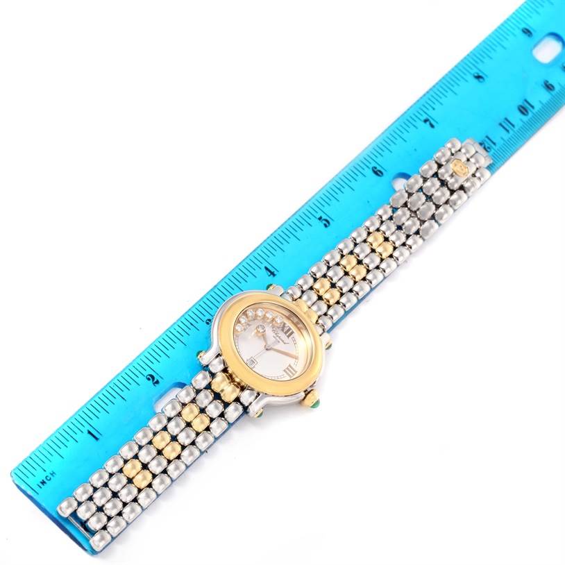 The Chopard 27/8276-22 Women's Steel and Gold (two tone) White Dial 27/8276-22 Women's Steel and Gold (two tone) White Dial Happy Sport Floating Diamond Gold and Steel Watch 27/8276-22 is shown from a top-down angle alongside a ruler.