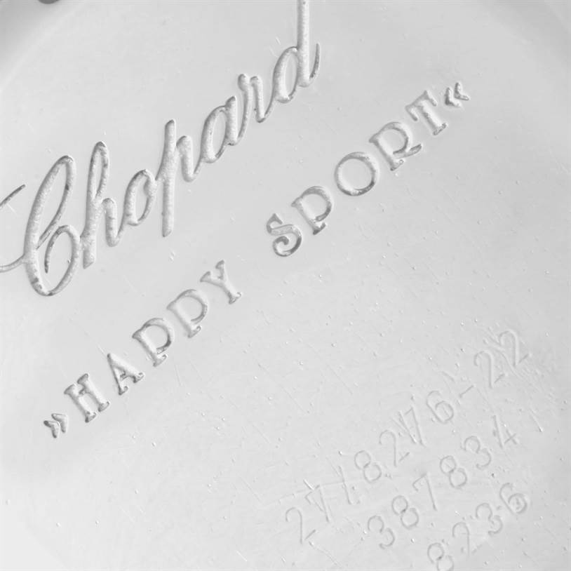 This image shows the engraved backplate of the Chopard 27/8276-22 Women's Steel and Gold (two tone) White Dial 27/8276-22 Women's Steel and Gold (two tone) White Dial Happy Sport Floating Diamond Gold and Steel Watch 27/8276-22.