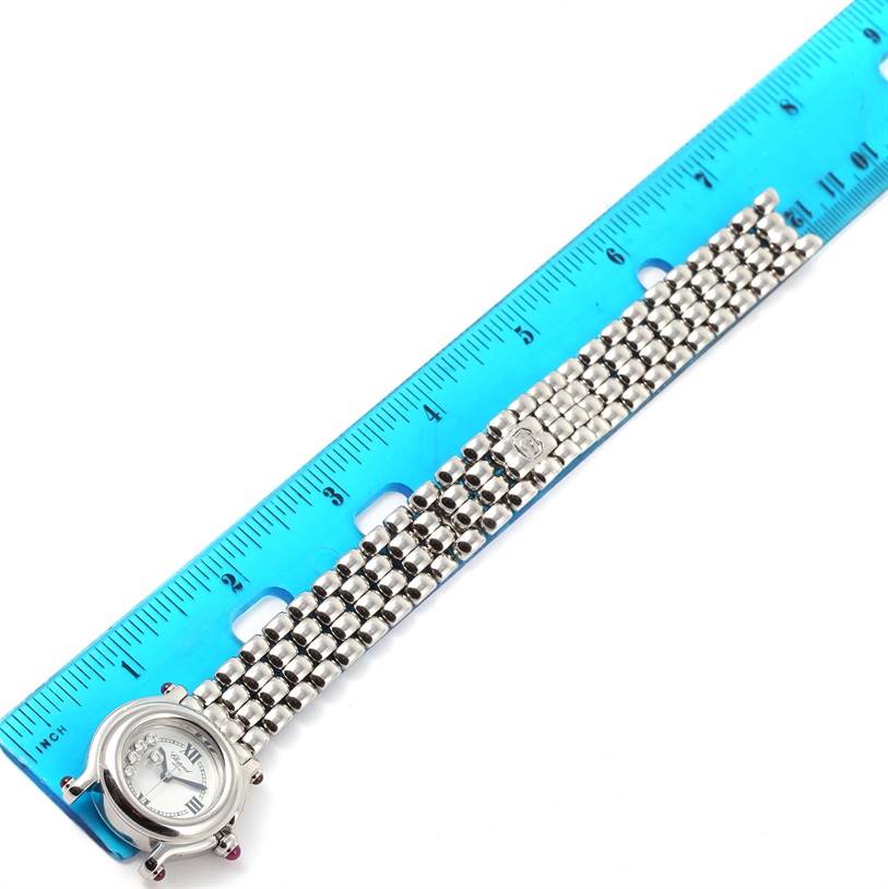 This image shows a flat, top-down view of the Chopard 27/8250-21 Women's Stainless Steel White Dial 27/8250-21 Women's Stainless Steel White Dial Happy Sport 27/8250-21 watch, displaying its white dial, 5 floating diamonds, and metal bracelet alongside a ruler for scale.