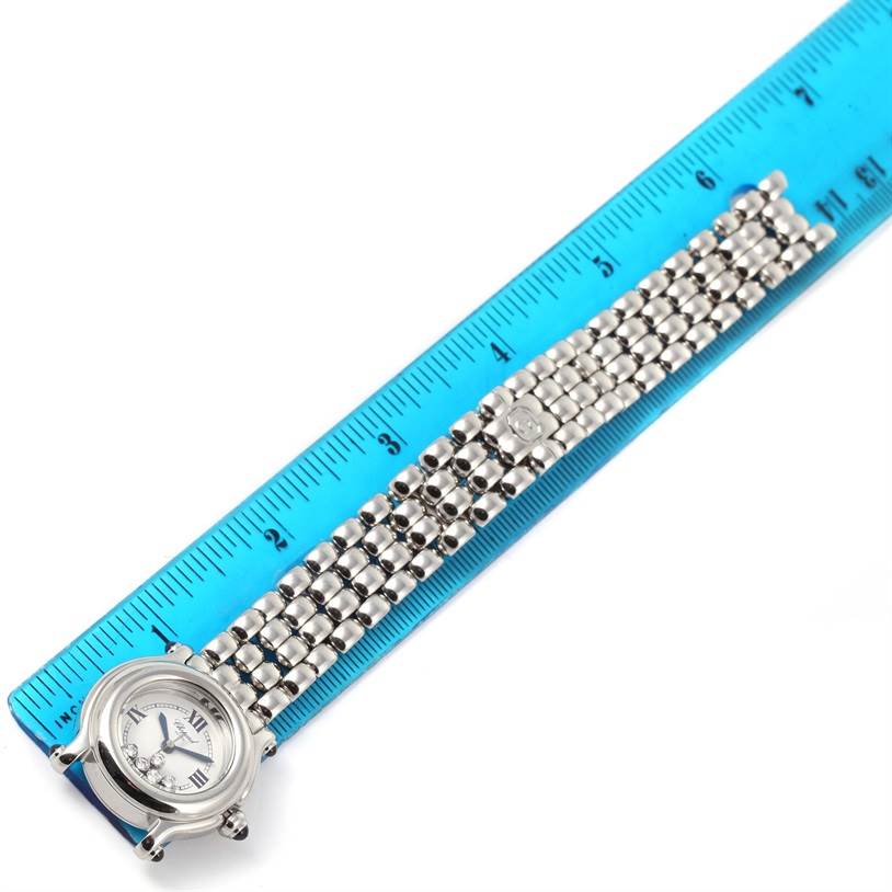 The Chopard 27-8250 Women's Stainless Steel White Dial 27-8250 Women's Stainless Steel White Dial Happy Sport 5 Floating Diamonds Steel Ladies Watch 27-8250 is shown lying flat next to a ruler, displaying the watch face and bracelet.