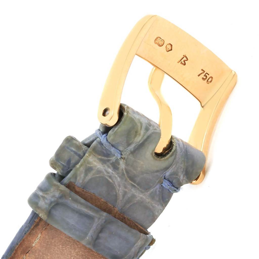 The image shows the gold buckle and part of the leather strap of a Chopard 27/7012-23 Women's Yellow Gold White Dial 27/7012-23 Women's Yellow Gold White Dial Happy Diamond Yellow Gold Floating Diamonds Watch model 27/7012-23.