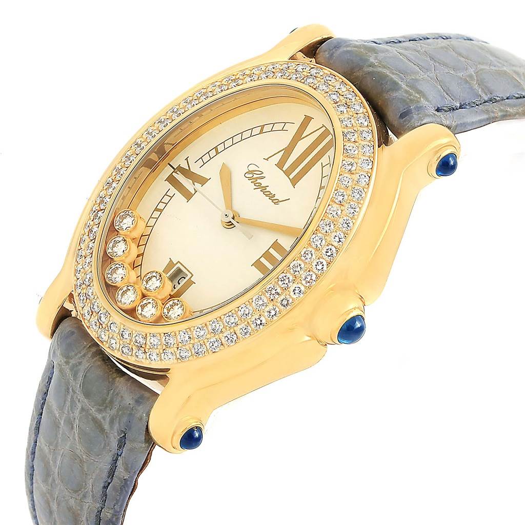 The Chopard 27/7012-23 Women's Yellow Gold White Dial 27/7012-23 Women's Yellow Gold White Dial Happy Diamond Yellow Gold Floating Diamonds Watch 27/7012-23 is shown at an oblique angle, highlighting the face, bezel, and band.