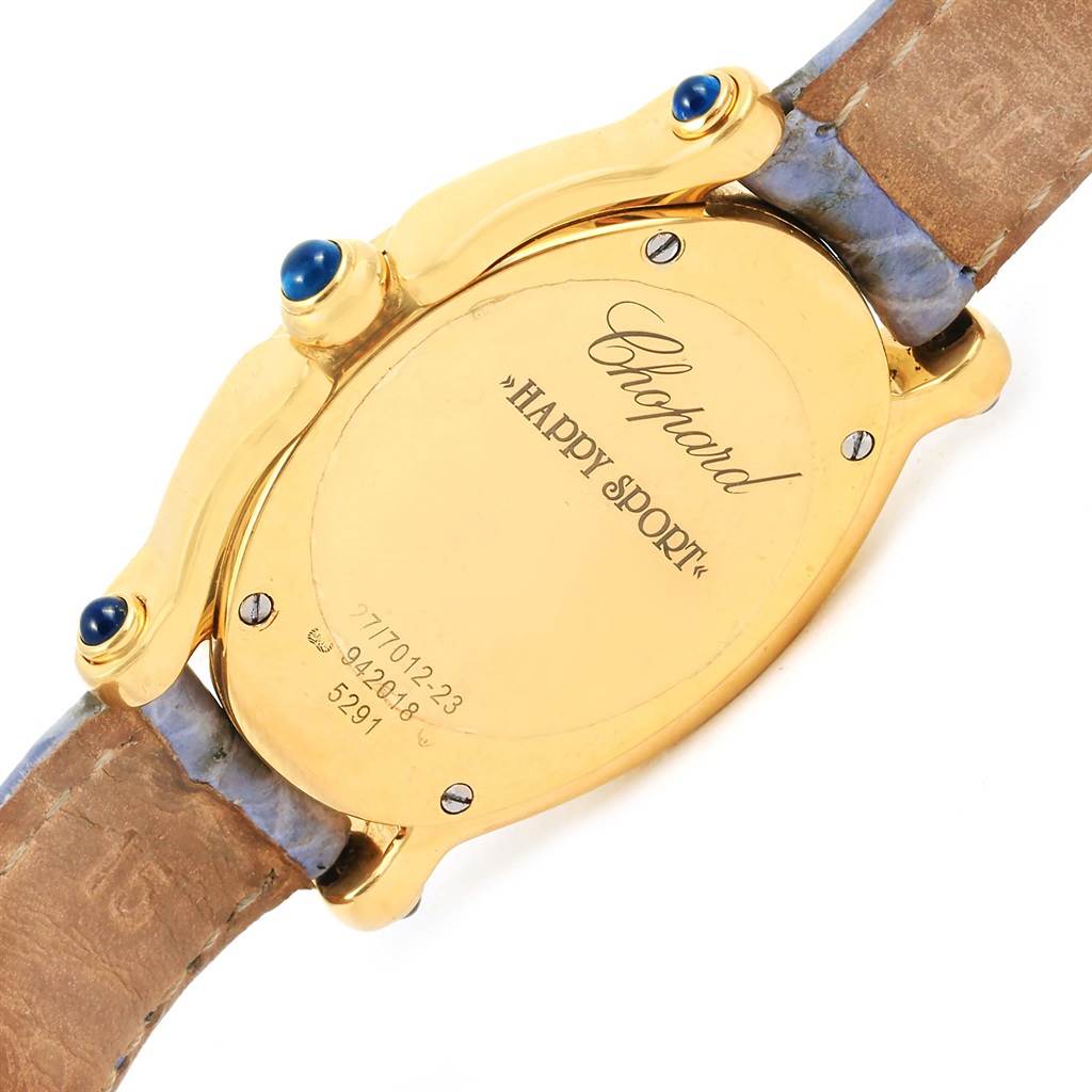 This image shows the back view of the Chopard 27/7012-23 Women's Yellow Gold White Dial 27/7012-23 Women's Yellow Gold White Dial Happy Diamond Yellow Gold Floating Diamonds Watch 27/7012-23 model, highlighting its case back and leather strap.