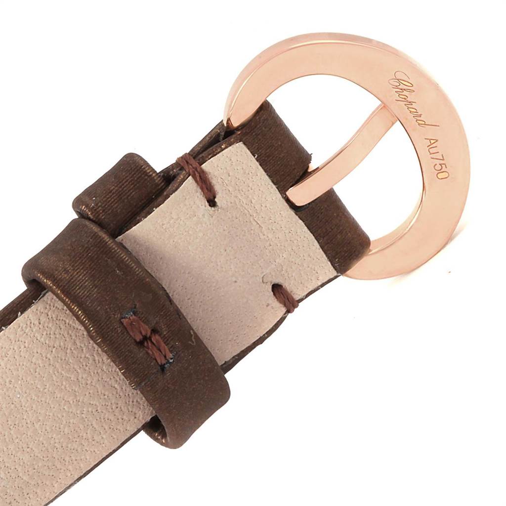 This image shows the brown leather strap and rose gold buckle of the Chopard 4596 Women's Rose Gold Mother of Pearl Dial 4596 Women's Rose Gold Mother of Pearl Dial Happy Diamond Rose Gold Floating Diamonds Watch 4596 model.