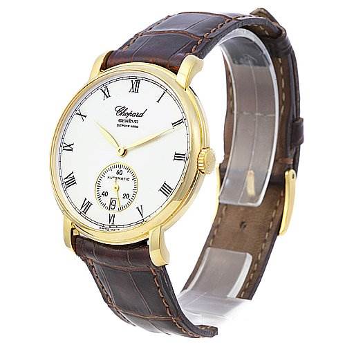 The photo shows a side angle view of the Chopard 16-1223 Yellow Gold White Dial 16-1223 Yellow Gold White Dial Les Classique Luc Homme 18k Yellow Gold 16/1223 model, highlighting the watch face and leather strap.