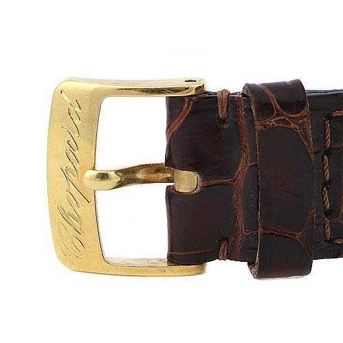 The image shows a close-up of the buckle and strap of a Chopard 16-1223 Yellow Gold White Dial 16-1223 Yellow Gold White Dial Les Classique Luc Homme 18k Yellow Gold 16/1223 watch.