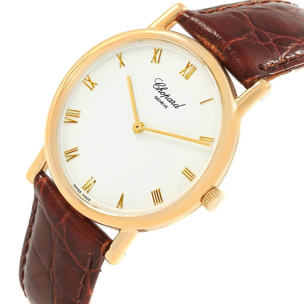 This image shows a Chopard Classique 16/3154 Men's Yellow Gold White Dial 16/3154 Men's Yellow Gold White Dial watch at an angled view highlighting the dial, gold case, and brown leather strap.