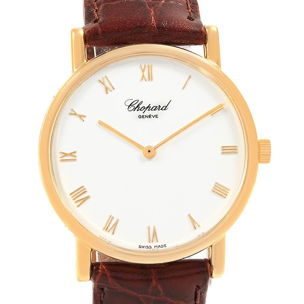 This is a front view of the Chopard Classique 16/3154 Men's Yellow Gold White Dial 16/3154 Men's Yellow Gold White Dial watch, showing its white dial, gold case, Roman numerals, and a brown leather strap.