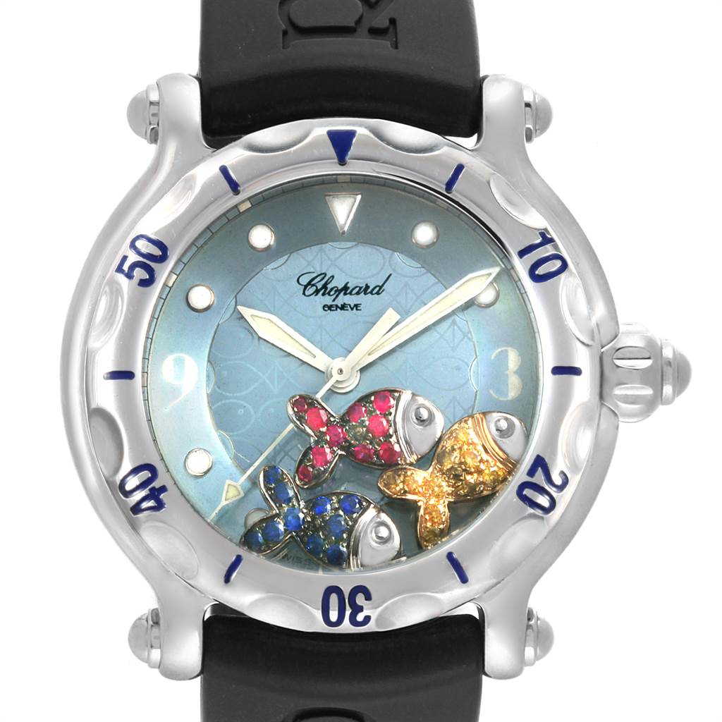 The image shows a front view of the Chopard 288347 Women's Stainless Steel Blue Dial 288347 Women's Stainless Steel Blue Dial Happy Beach Floating Rubi Sapphire Fish Ladies Watch 288347, highlighting the dial and bezel.