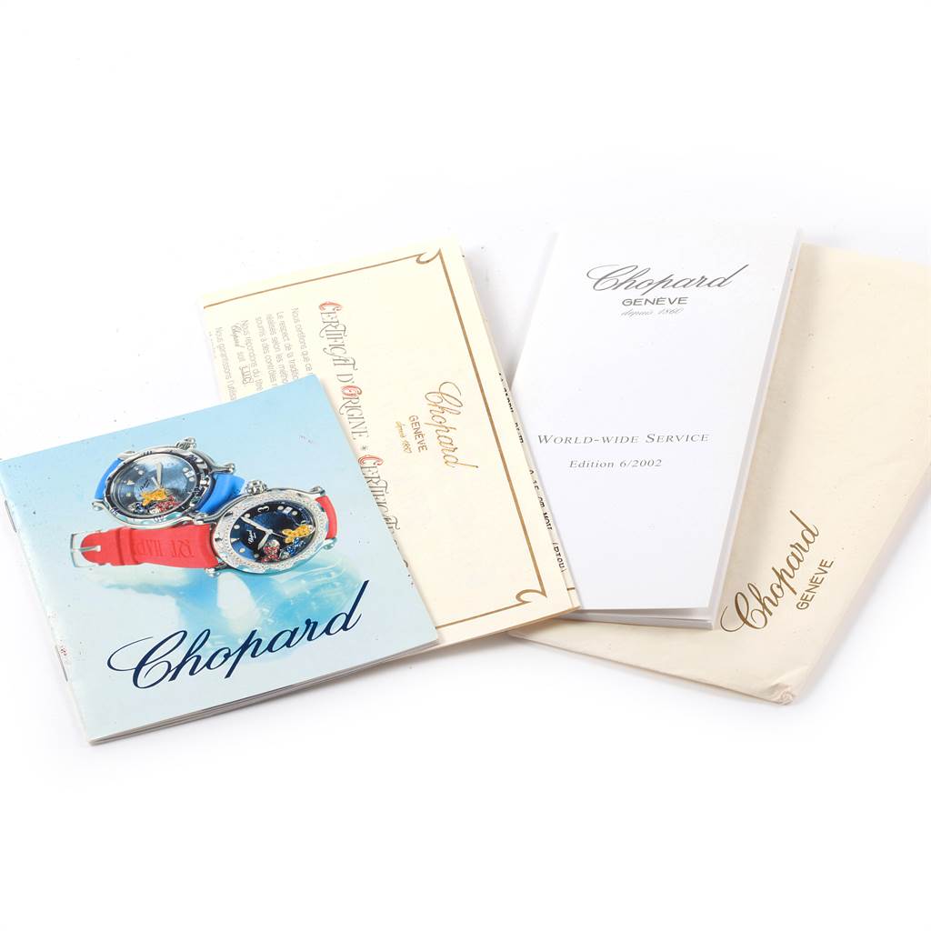 The image shows documentation and booklets for the Chopard 288347 Women's Stainless Steel Blue Dial 288347 Women's Stainless Steel Blue Dial Happy Beach Floating Rubi Sapphire Fish Ladies Watch 288347 model.