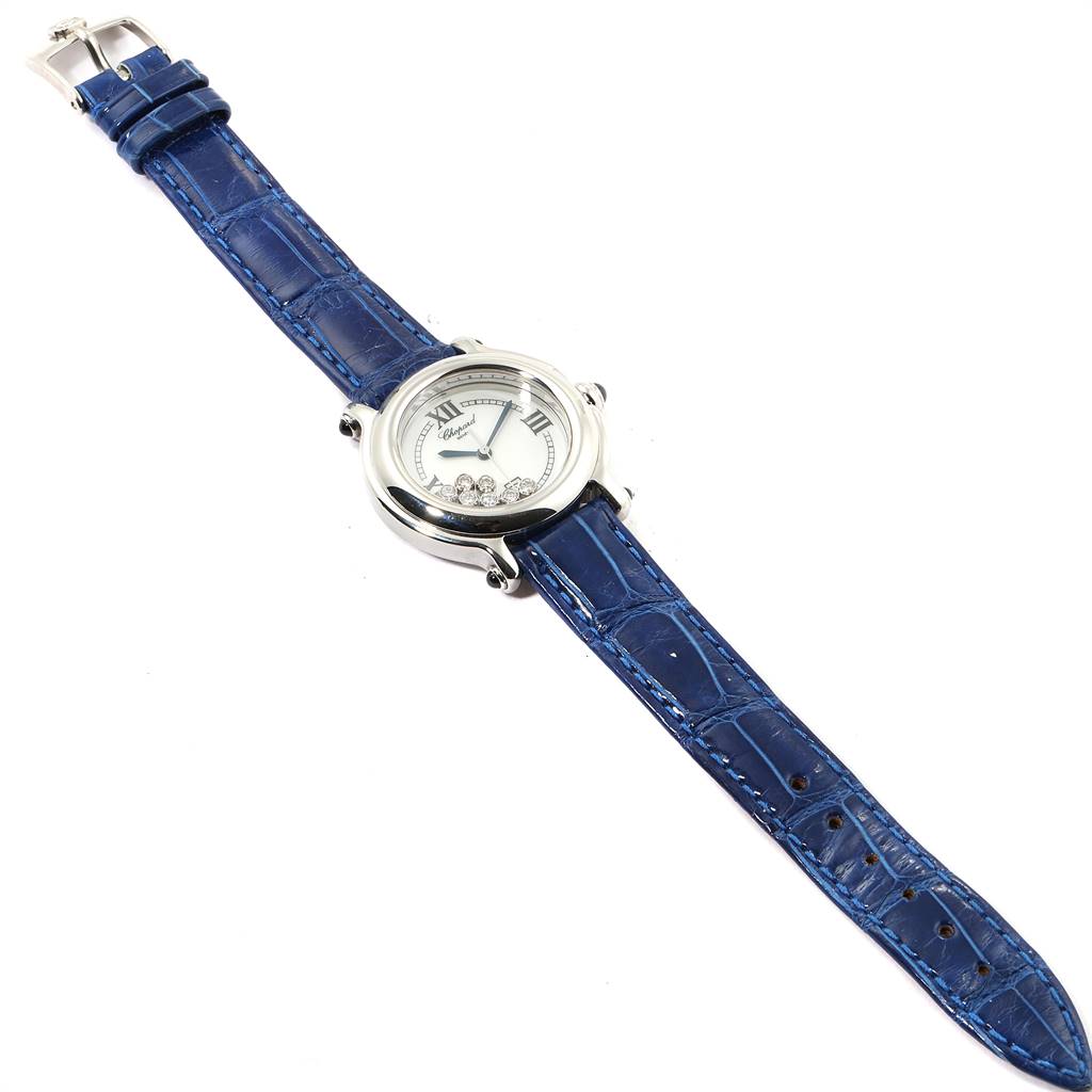 The Chopard 8236 Women's Stainless Steel White Dial 8236 Women's Stainless Steel White Dial Happy Sport 8236 watch is shown from an aerial angle, displaying its white dial, blue strap, and 7 floating diamonds.
