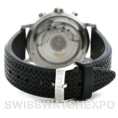 This image shows the back view of the Chopard Mille Miglia 16-8331 Men's Stainless Steel Red Dial 16-8331 Men's Stainless Steel Red Dial watch, including the case back and textured black rubber strap with a buckle.