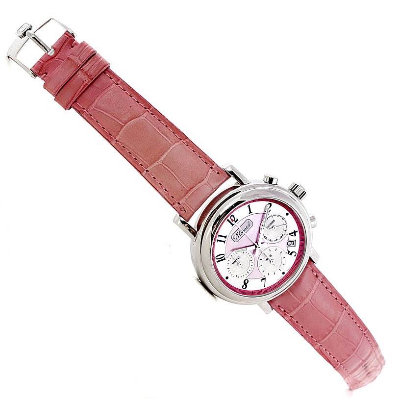 The image shows a Chopard Mille Miglia 8331 Men's Stainless Steel Pink Dial 8331 Men's Stainless Steel Pink Dial watch at an angled side view, highlighting its pink leather strap and silver chronograph dials.