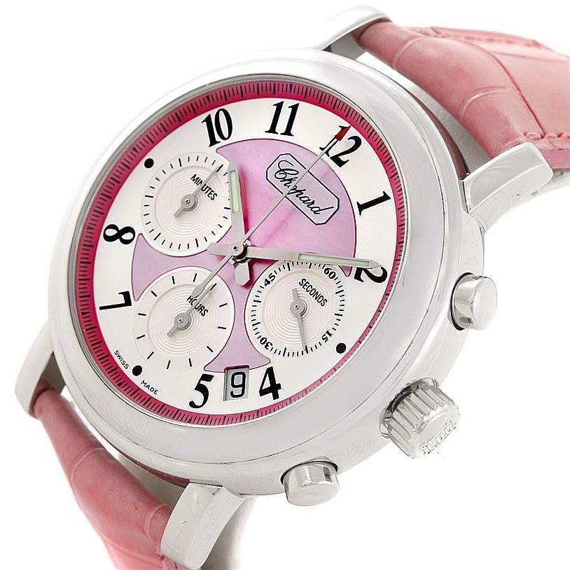 This image shows a close-up of the Chopard Mille Miglia 8331 Men's Stainless Steel Pink Dial 8331 Men's Stainless Steel Pink Dial watch featuring its pink dial, chronograph subdials, and pink leather strap.