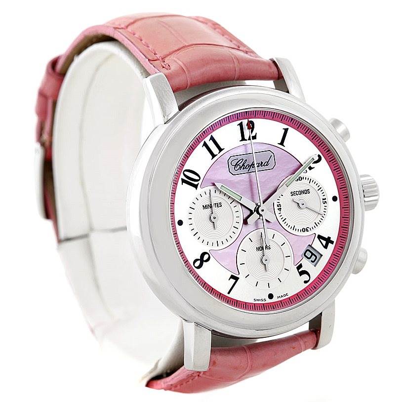 This Chopard Mille Miglia 8331 Men's Stainless Steel Pink Dial 8331 Men's Stainless Steel Pink Dial watch is shown at an angle highlighting the face, dials, crown, and pink leather strap.
