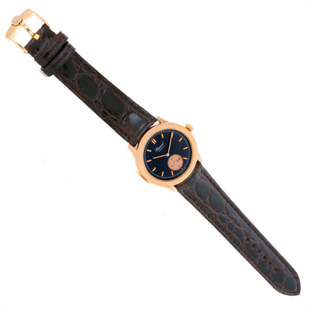 The image shows a Chopard Classique 16/1168 Men's Rose Gold Black Dial 16/1168 Men's Rose Gold Black Dial model watch from a top-down angle, displaying the watch face and leather strap.