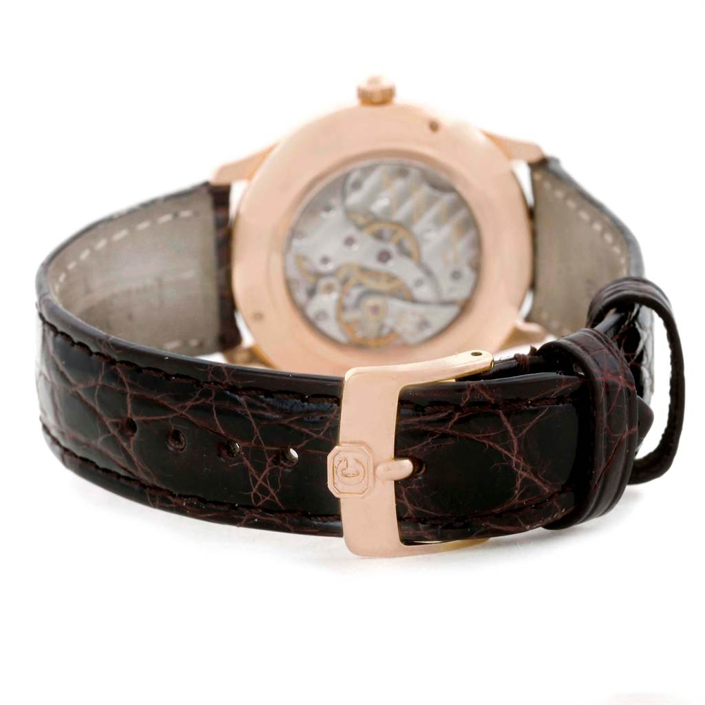 The Chopard Classique 16/1168 Men's Rose Gold Black Dial 16/1168 Men's Rose Gold Black Dial model is shown from the back, displaying its leather strap, clasp, and transparent case back revealing the movement.