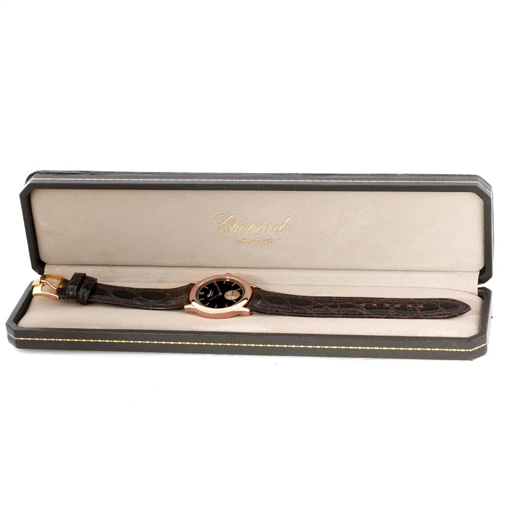 The image shows a Chopard Classique 16/1168 Men's Rose Gold Black Dial 16/1168 Men's Rose Gold Black Dial watch placed in an open box, viewed from the top.