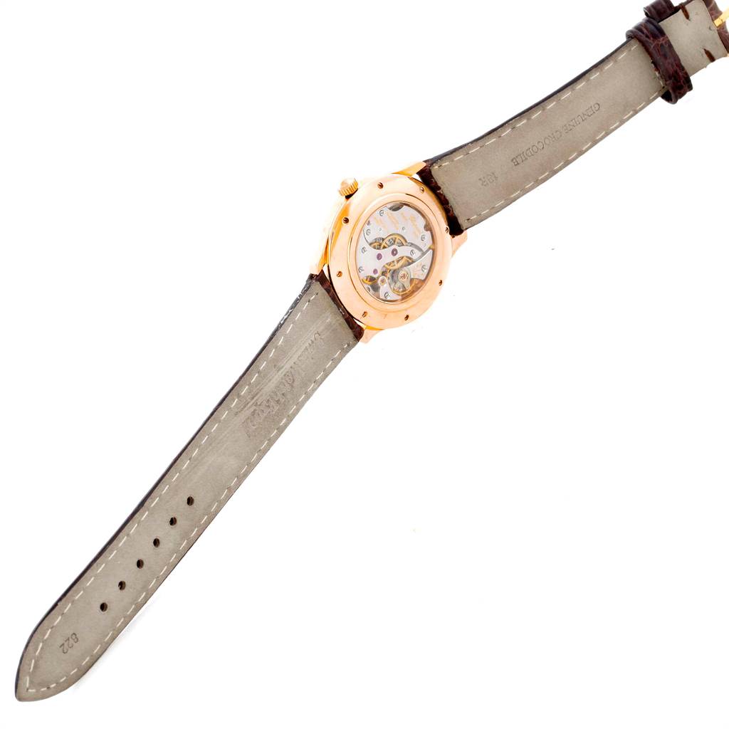 The image shows the back of the Chopard Classique 16/1168 Men's Rose Gold Black Dial 16/1168 Men's Rose Gold Black Dial watch, highlighting the transparent case back and the leather strap.