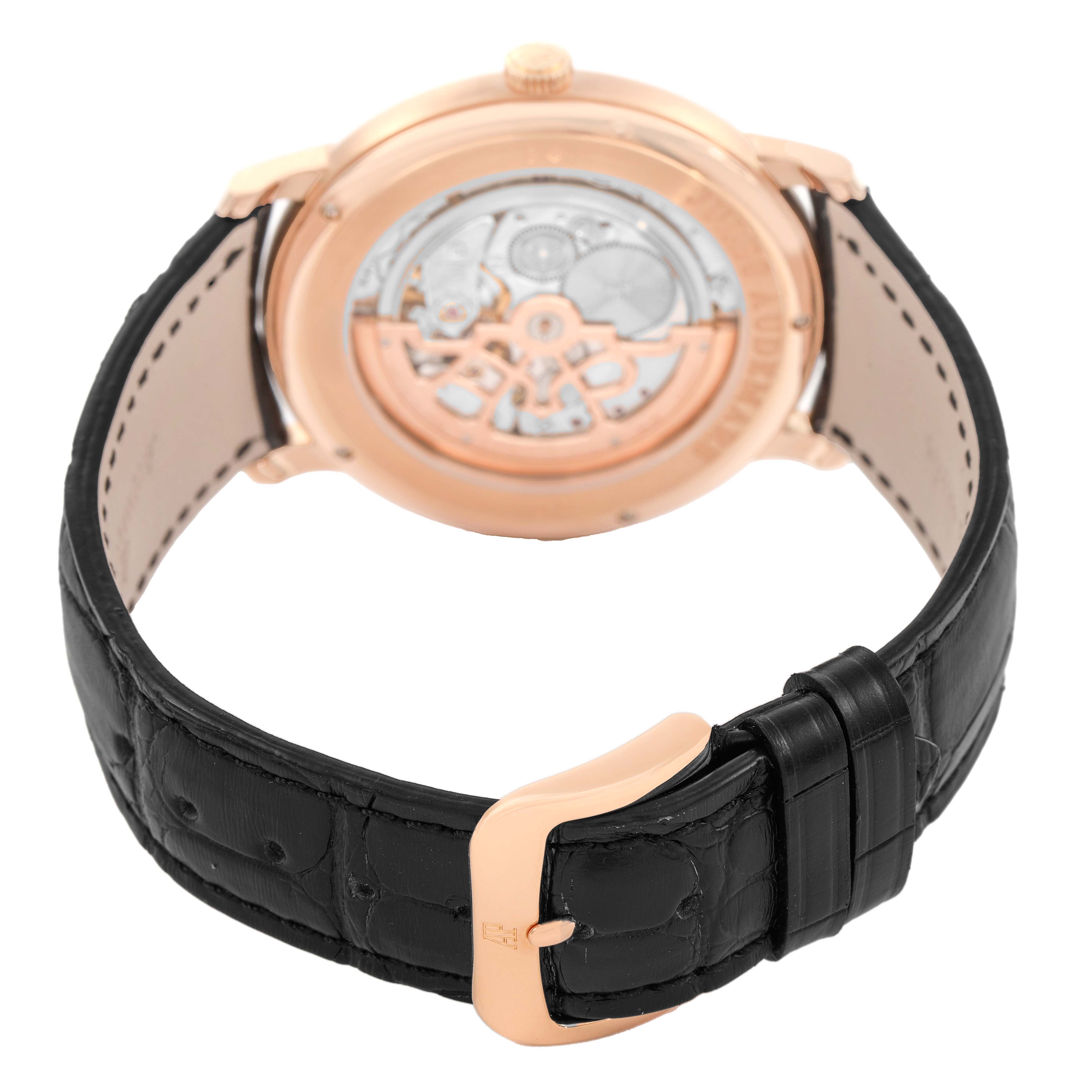 The image shows the back view of the Audemars Piguet Jules 15180R Men's Rose Gold Black Dial watch, highlighting the case back and leather strap with a buckle clasp.