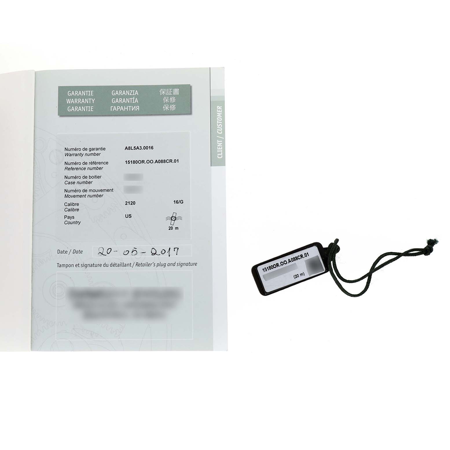 This image shows the warranty booklet and tag for the Jules Audemars model by Audemars Piguet.