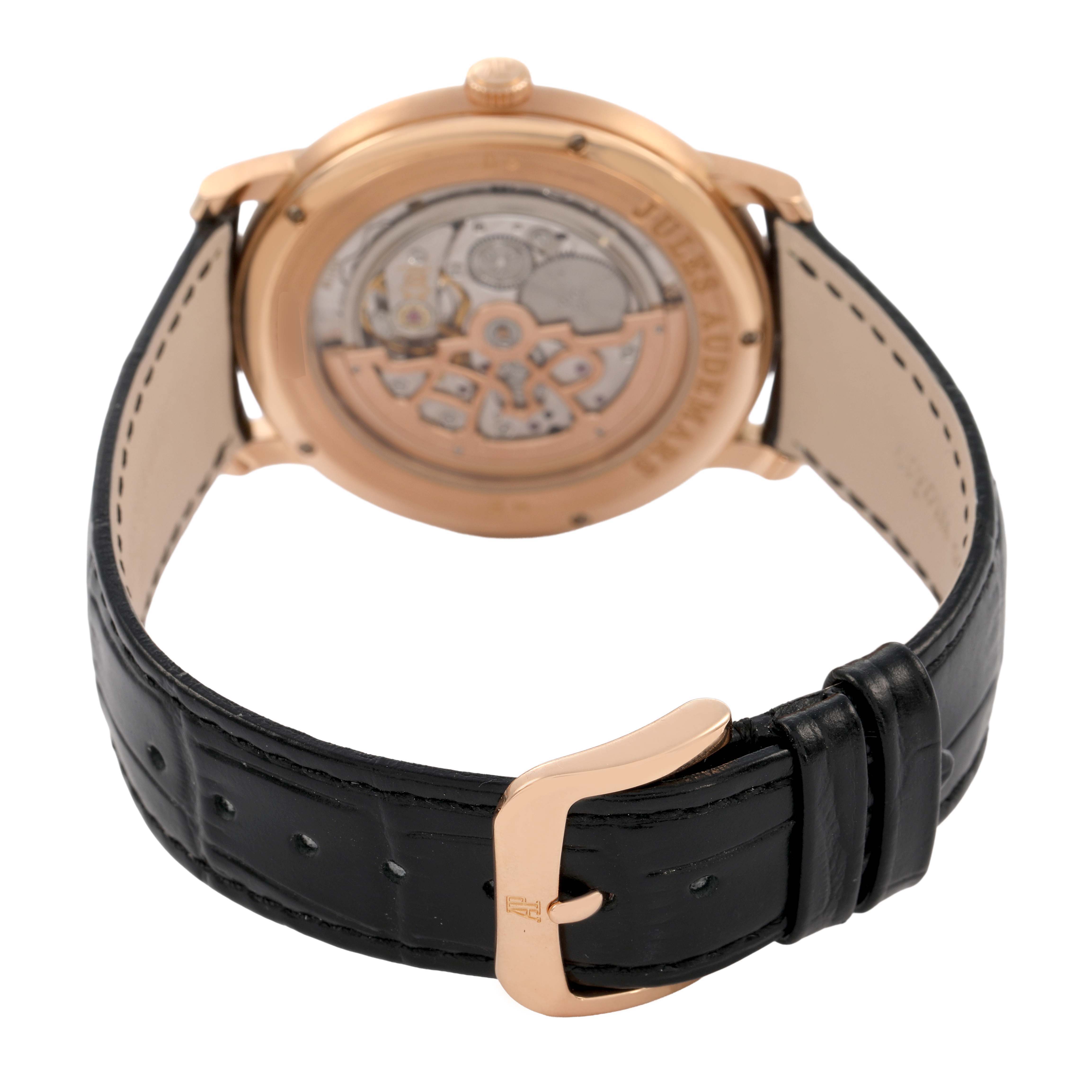 The image shows the back of the Audemars Piguet Jules 15180R Men's Rose Gold Silver Dial watch, highlighting the open case back and black leather strap with a gold buckle.