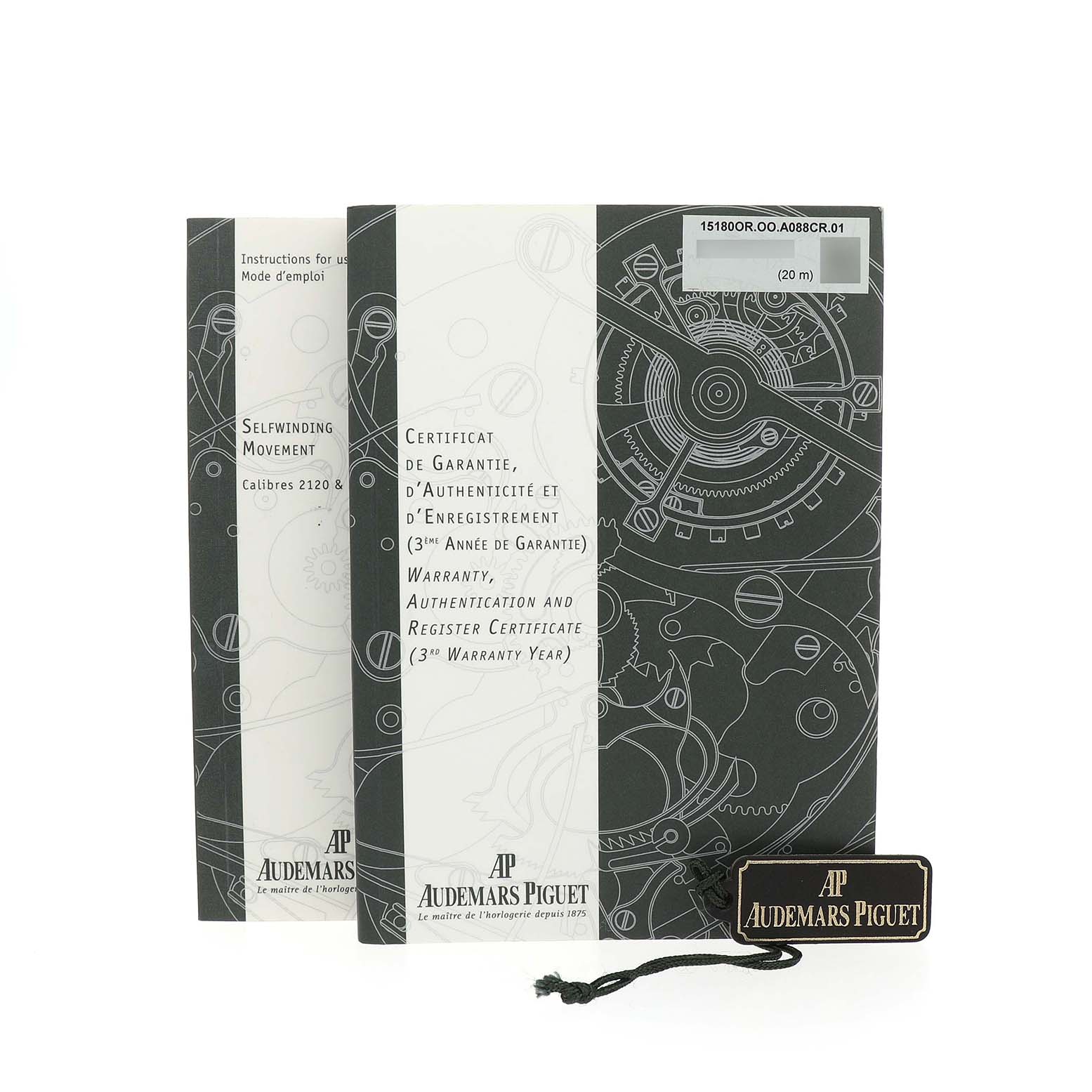 The image shows the instruction manuals and warranty card for the Audemars Piguet Jules 15180R Men's Rose Gold Silver Dial model, along with a branded tag.