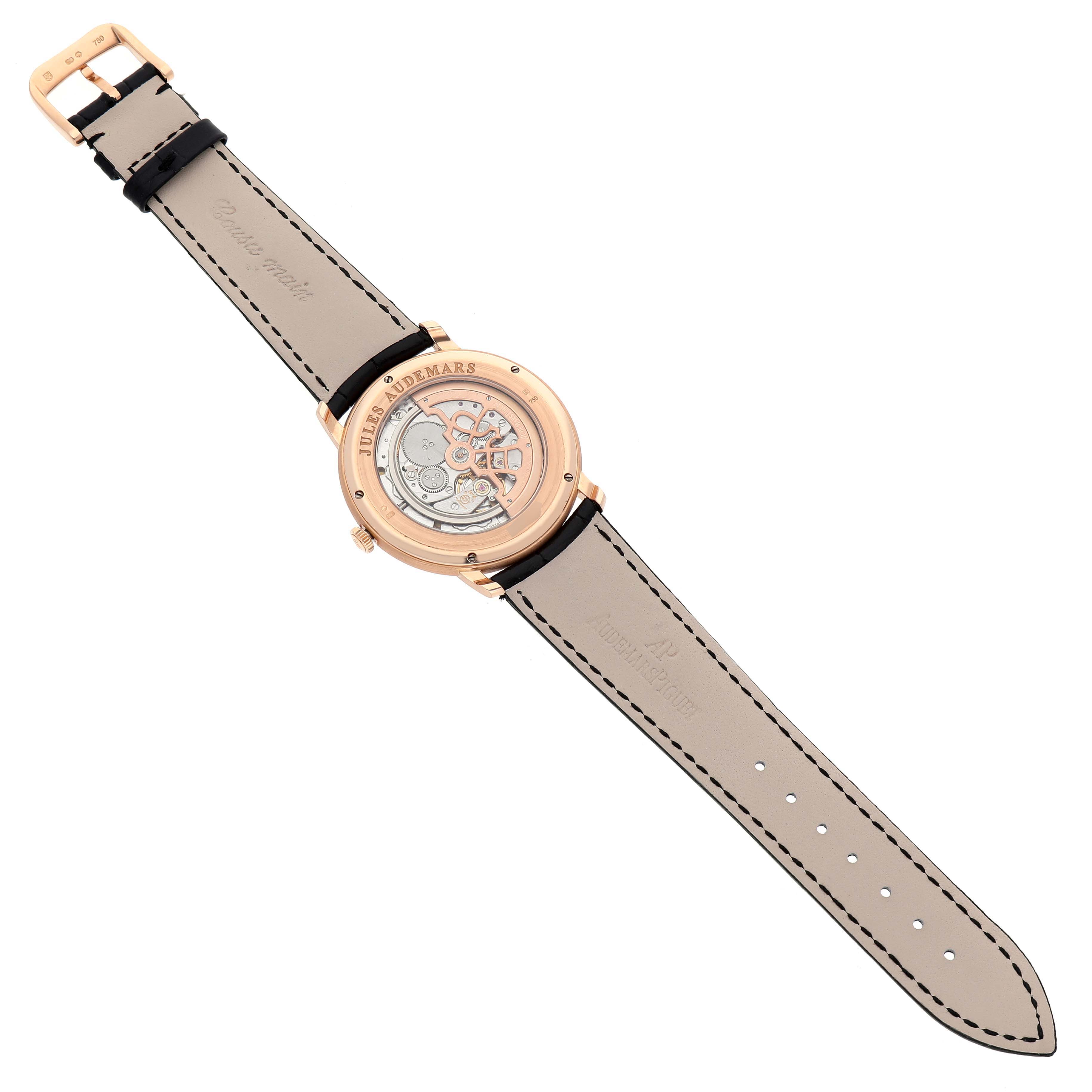 The image shows the back side of the Jules watch by Audemars Piguet, featuring the movement and leather strap.