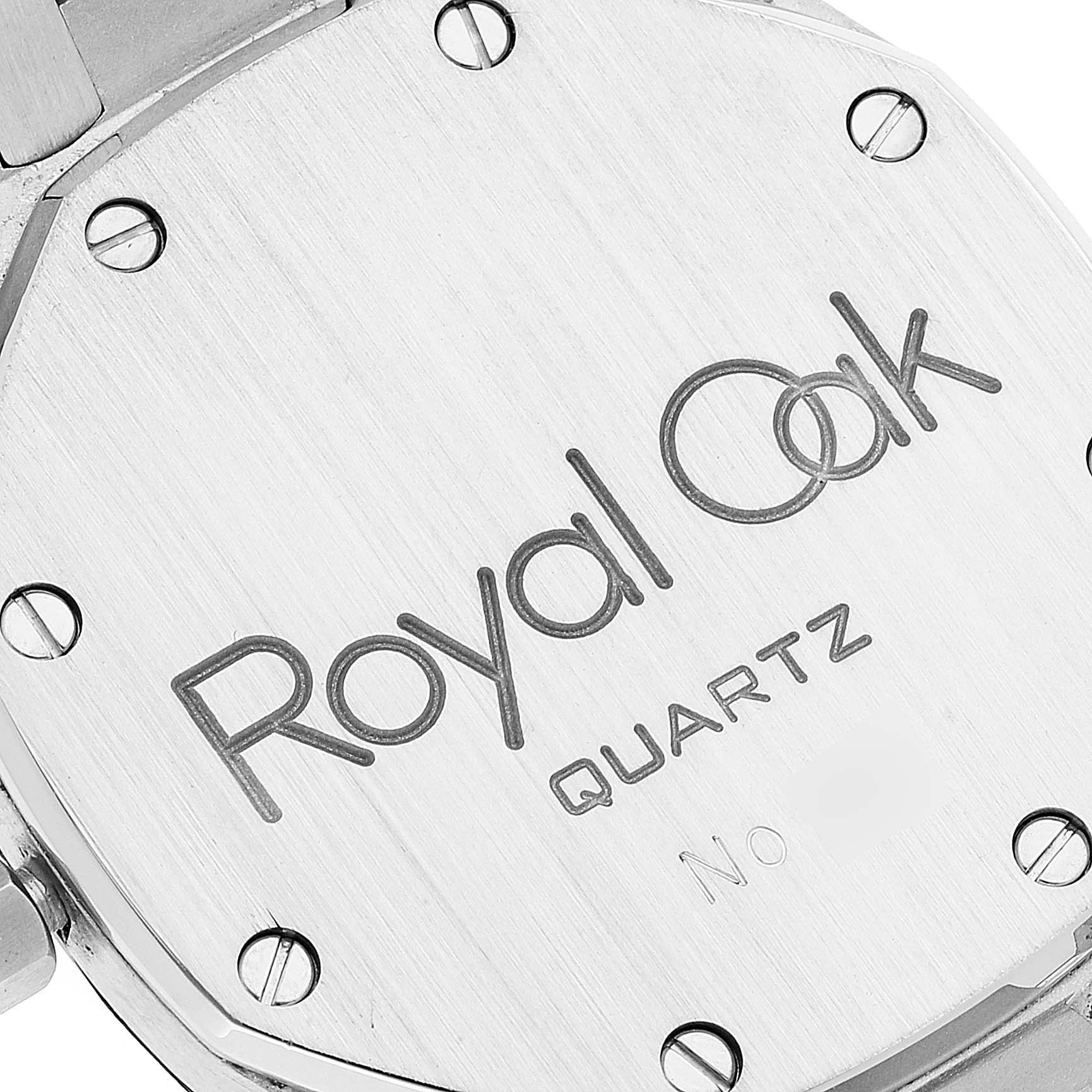 This is a close-up of the back casing of an Audemars Piguet Royal Oak 56023ST Men's Stainless Steel Black Dial 56023ST Men's Stainless Steel Black Dial watch, showing the engraved model name and screws.