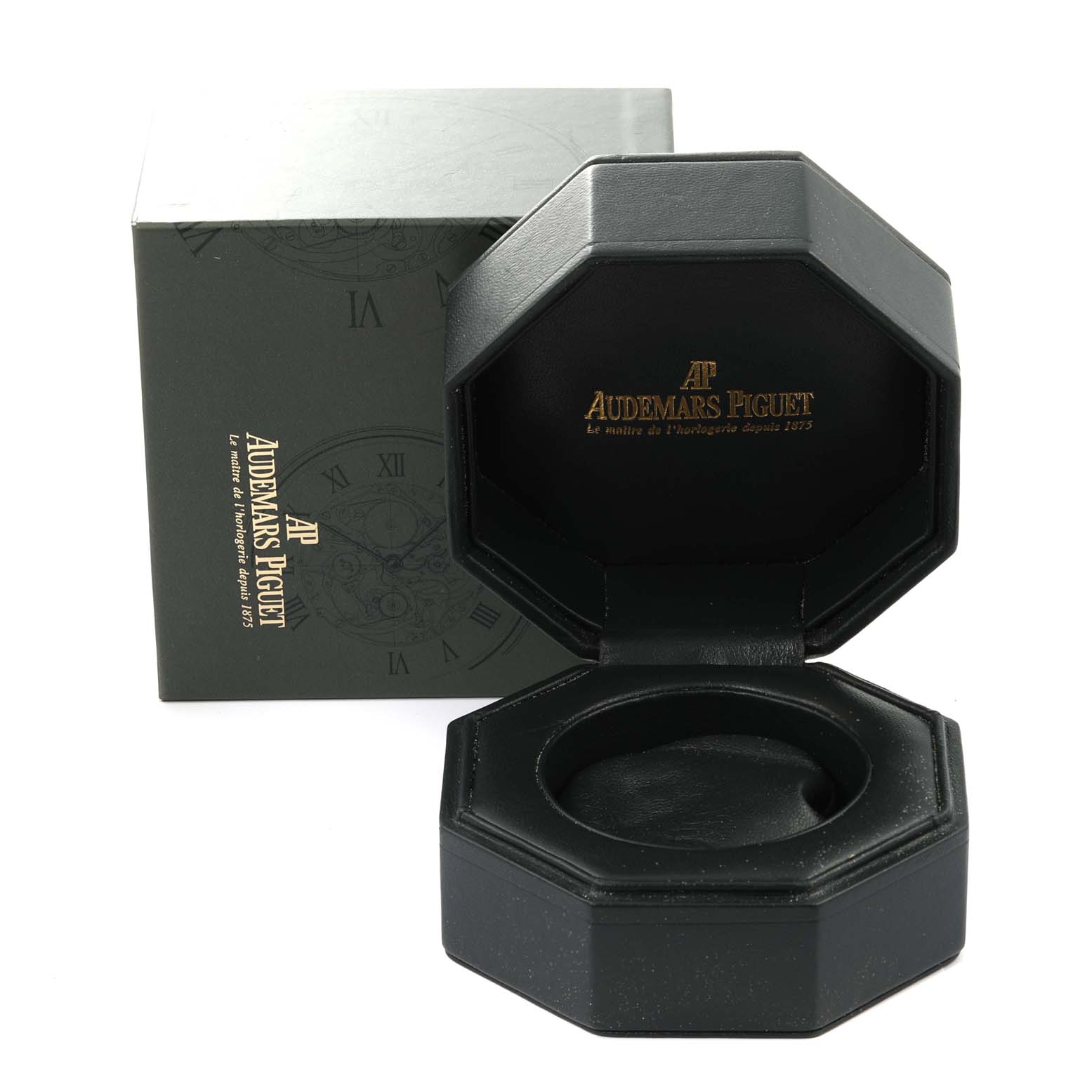 This image shows an open Royal Oak box by Audemars Piguet with its outer packaging in the background.