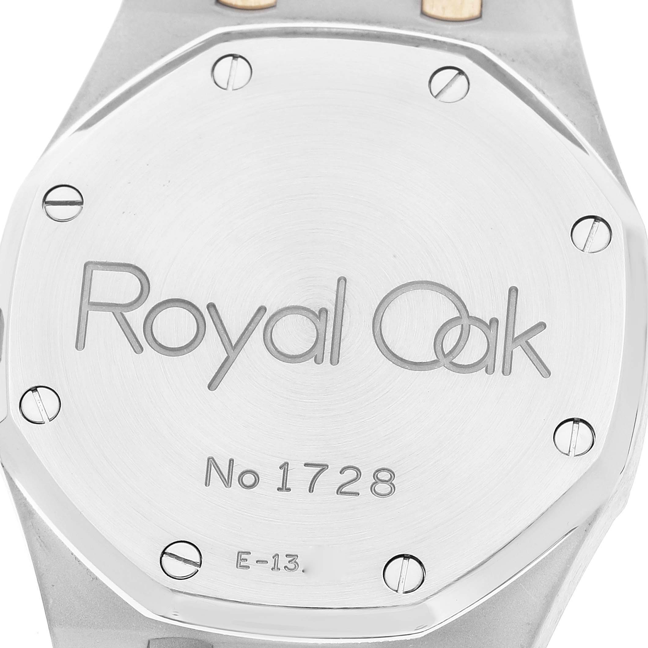 The image shows the case back of an Audemars Piguet Royal Oak 14790SA.OO.0789SA.01 Men's Steel and Gold (two tone) Grey Dial 14790SA.OO.0789SA.01 Men's Steel and Gold (two tone) Grey Dial model with its serial number and "Royal Oak" inscription.