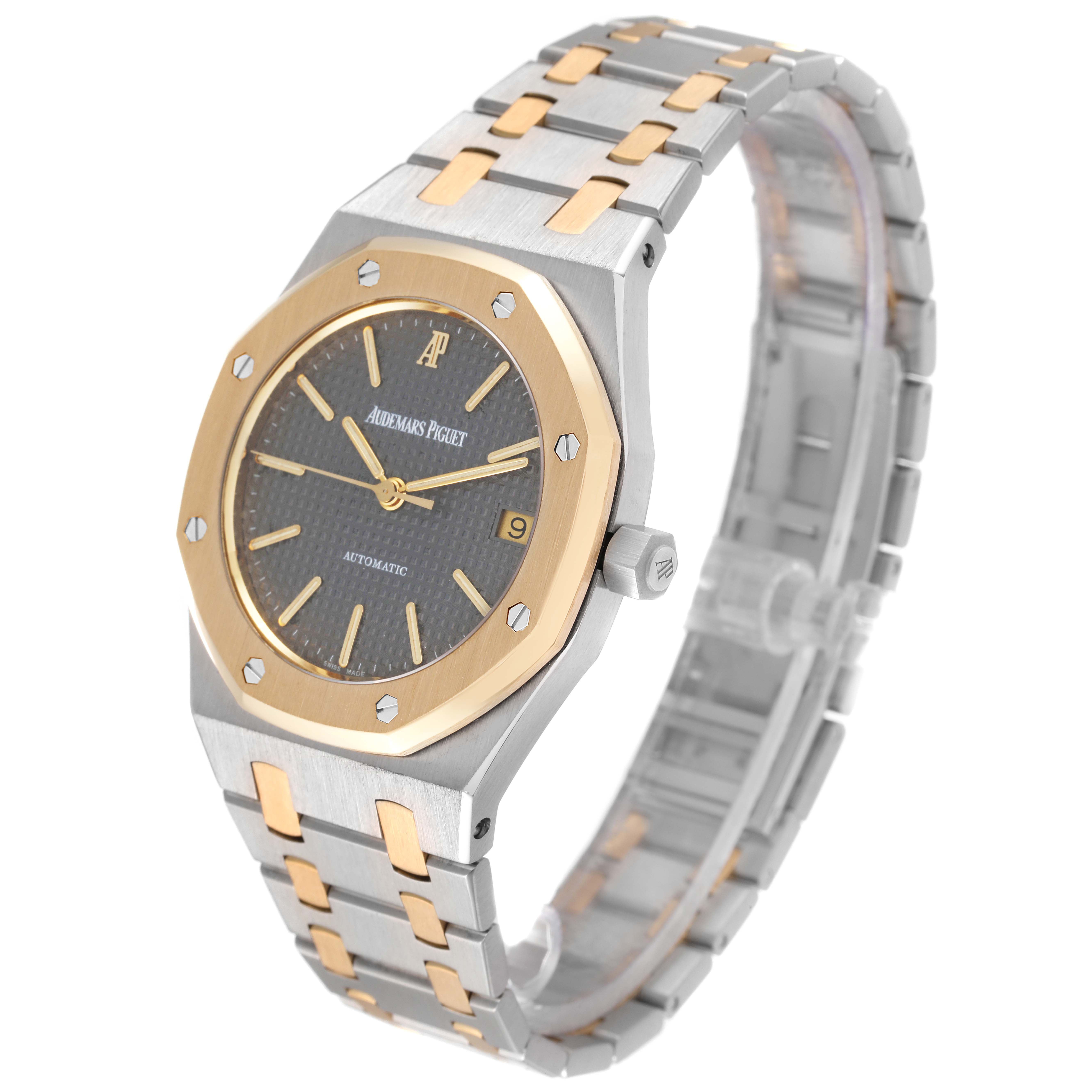 The image shows a side-angle view of the Audemars Piguet Royal Oak 14790SA.OO.0789SA.01 Men's Steel and Gold (two tone) Grey Dial 14790SA.OO.0789SA.01 Men's Steel and Gold (two tone) Grey Dial watch, highlighting its case, dial, bezel, and bracelet.