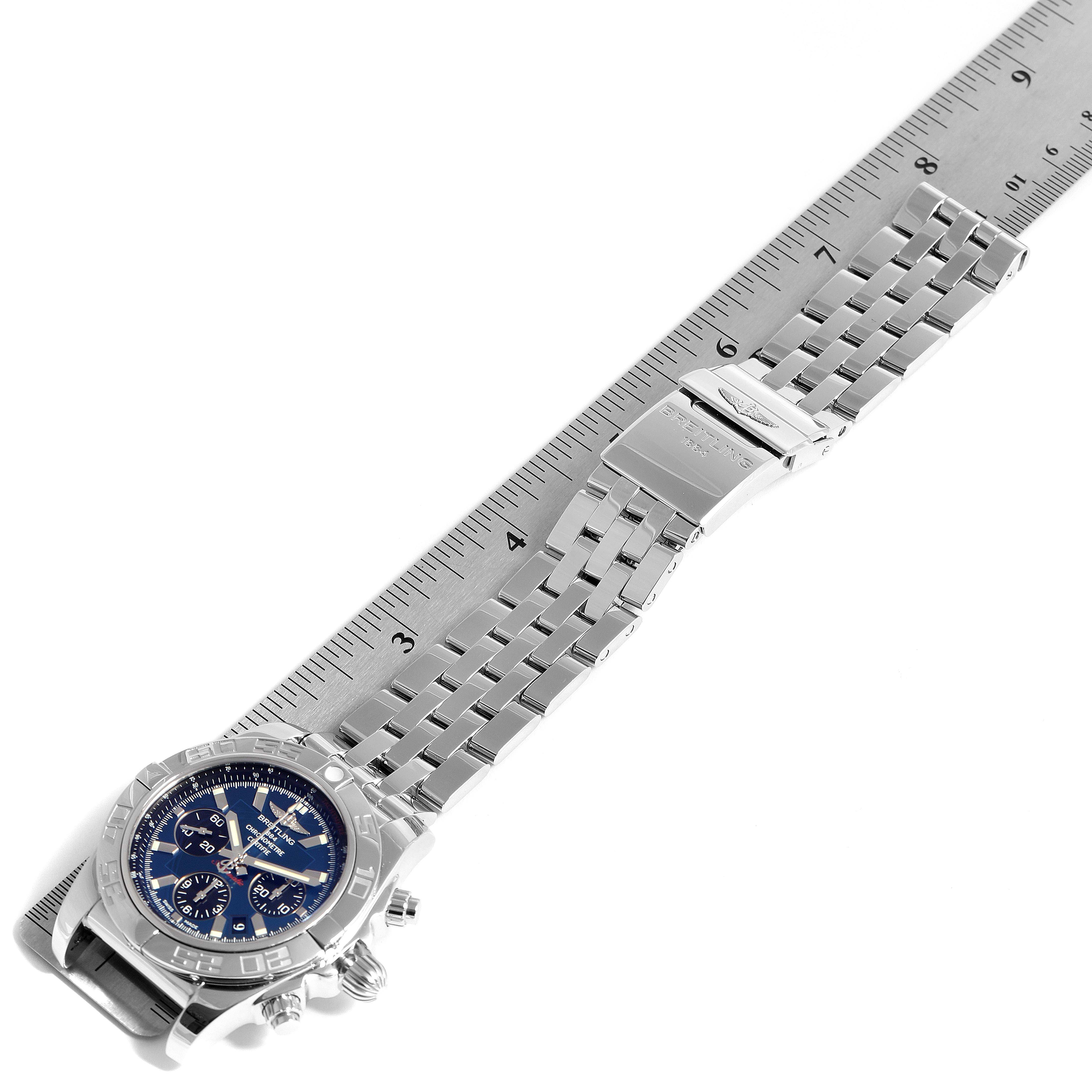 The image shows a Breitling Chronomat AB0110 Men's Stainless Steel Blue Dial AB0110 Men's Stainless Steel Blue Dial watch with a steel bracelet and clasp, placed next to a ruler for measurement.