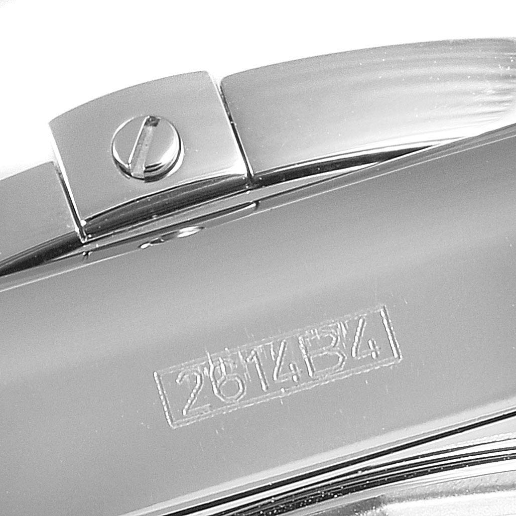 The image shows a close-up of the clasp and part of the bracelet of a Breitling Chronomat AB0110 Men's Stainless Steel Blue Dial AB0110 Men's Stainless Steel Blue Dial watch with a visible serial number.