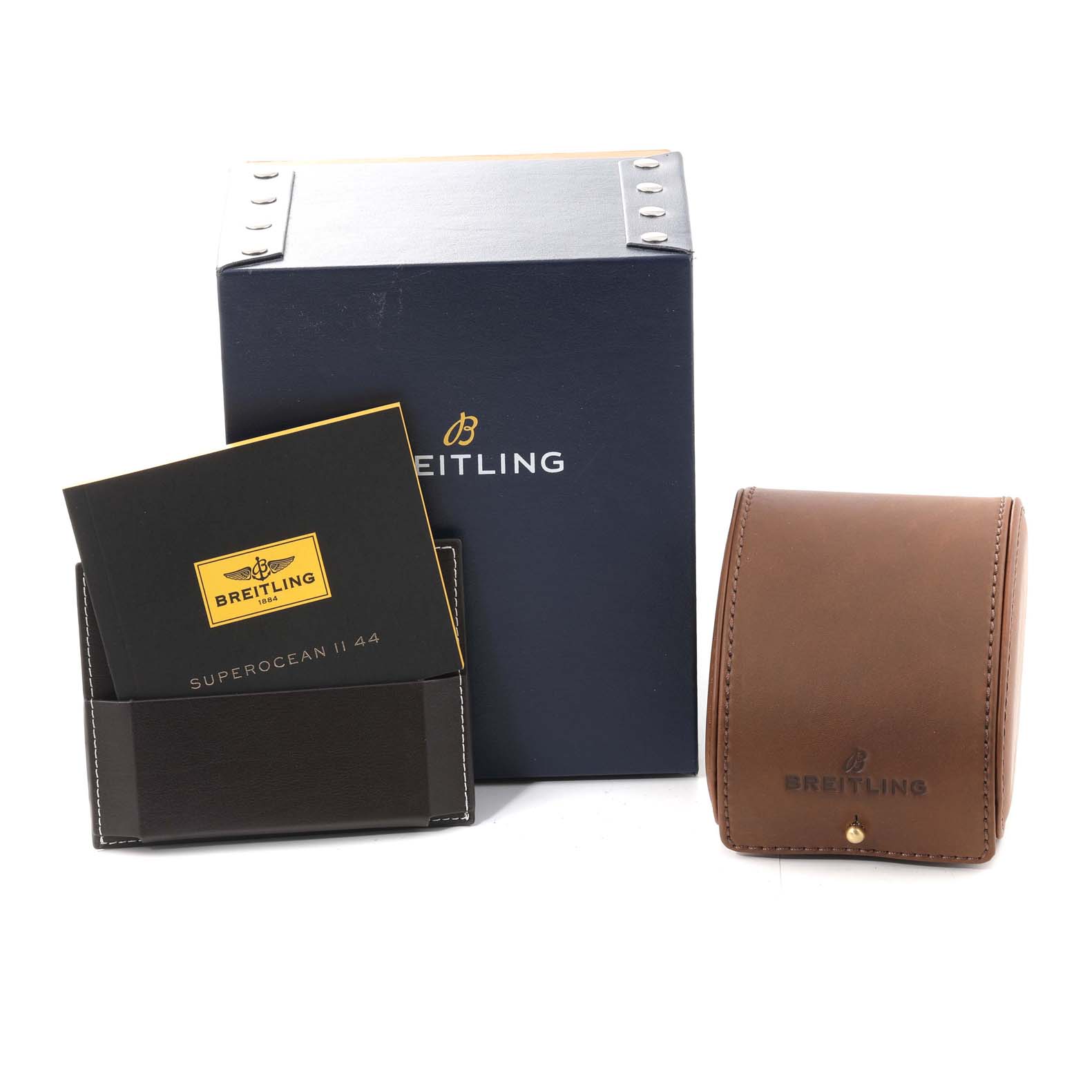 The image shows a Breitling Navitimer AB0120 Men's Stainless Steel Black Dial AB0120 Men's Stainless Steel Black Dial watch box, warranty booklet, and a brown leather case.