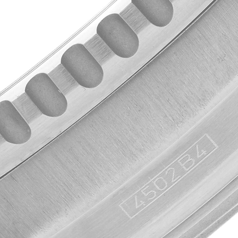 This close-up image shows part of the bezel and engraved serial number on a Breitling Navitimer A41322 Men's Stainless Steel Black Dial A41322 Men's Stainless Steel Black Dial watch.