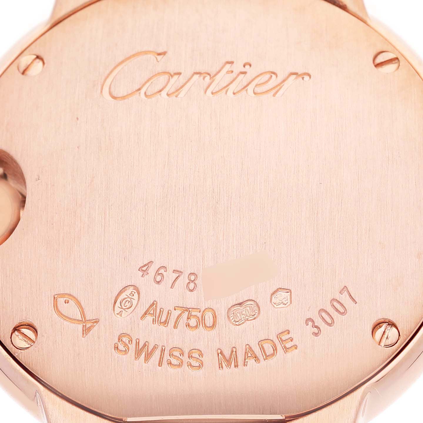The image shows the case back of a Cartier Ballon Bleu W69002Z2 Women's Rose Gold Silver Dial watch, displaying engravings and hallmarks.