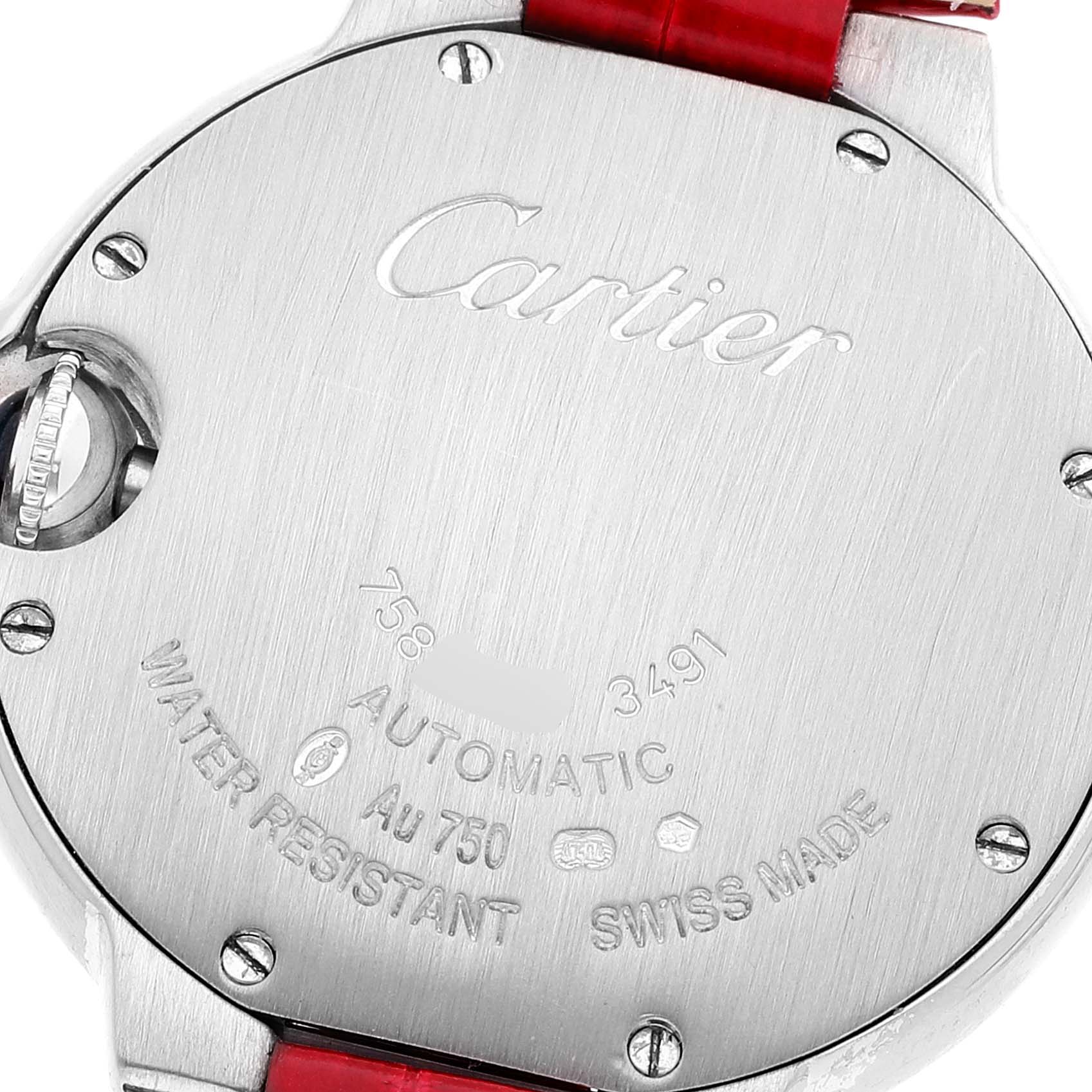 The image shows the back case of a Cartier Ballon Bleu WE902067 Women
s White Gold Silver Dial WE902067 Women
s White Gold Silver Dial watch, highlighting the engraved details and the crown.